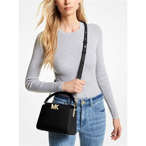 Karlie Small Leather Crossbody Bag .